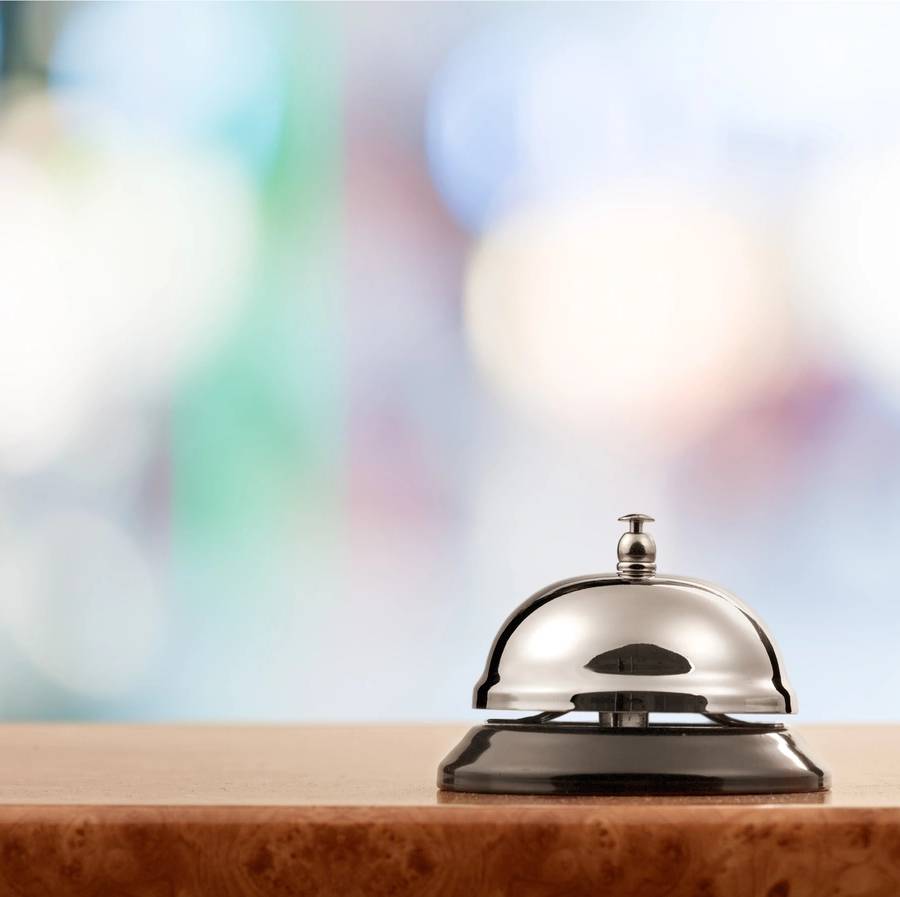 Vintage hotel reception service desk bell.